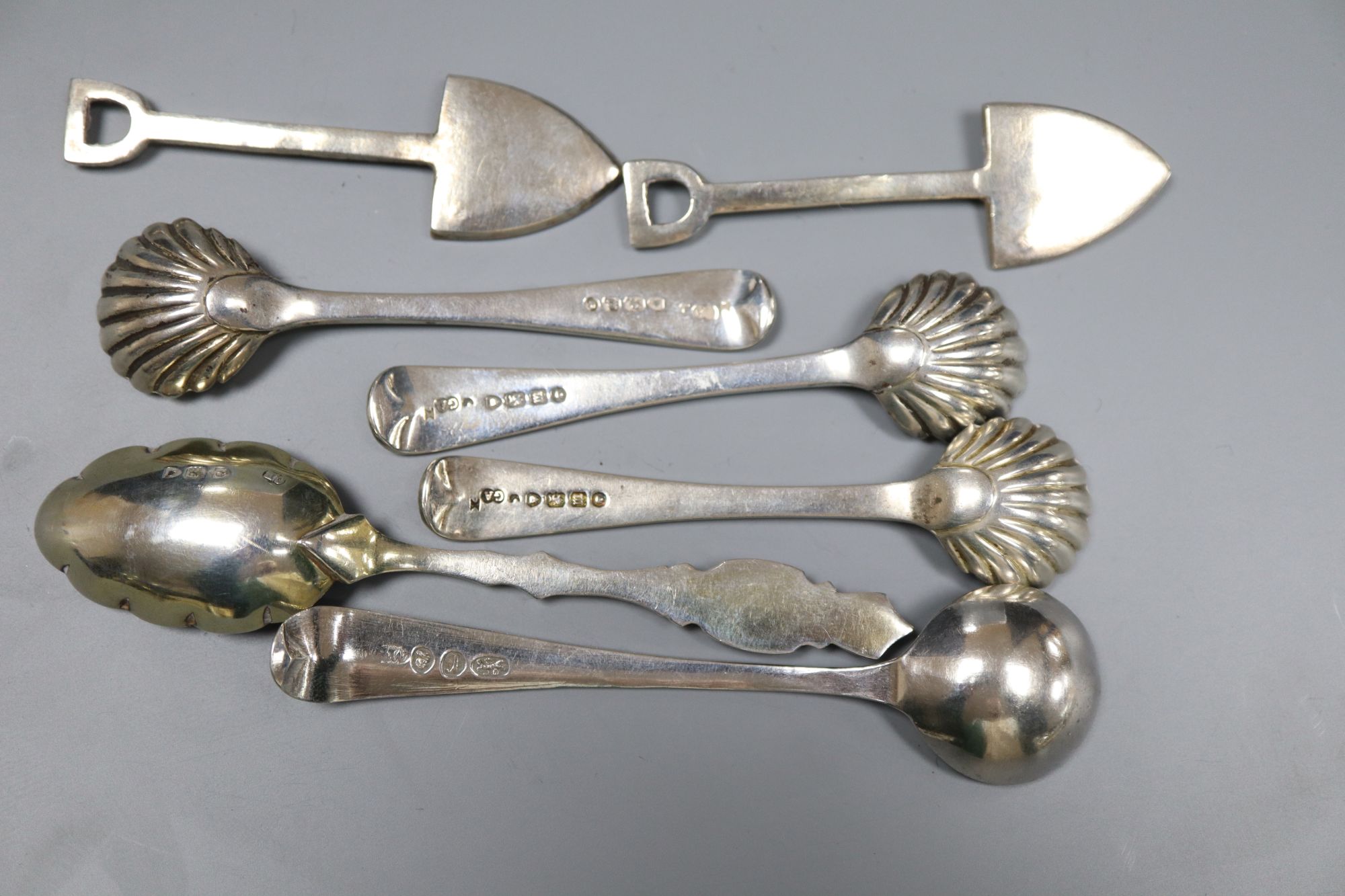Five assorted 19th century silver condiment spoons and two white metal condiment shovels